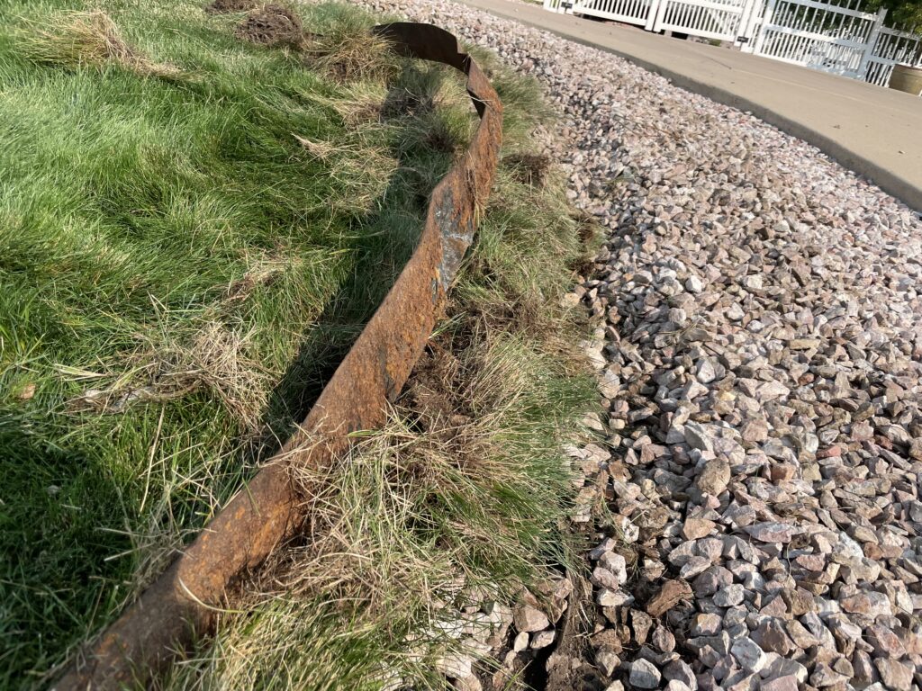 Metal lawn edging rusted knife